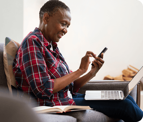 Person using laptop and phone